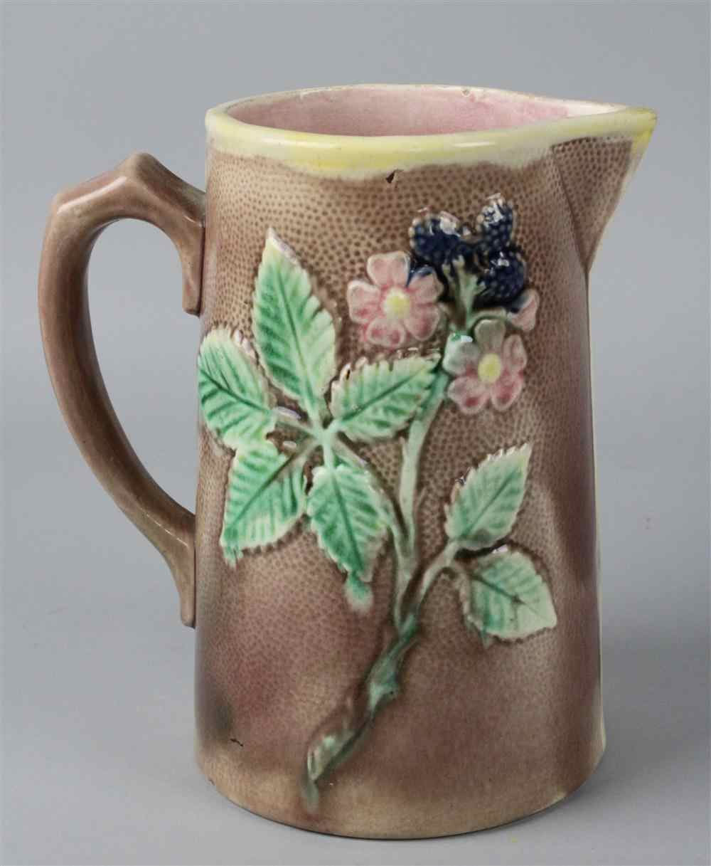 Appraisal: AMERICAN MAJOLICA JUG with strap handle and beak spout molded