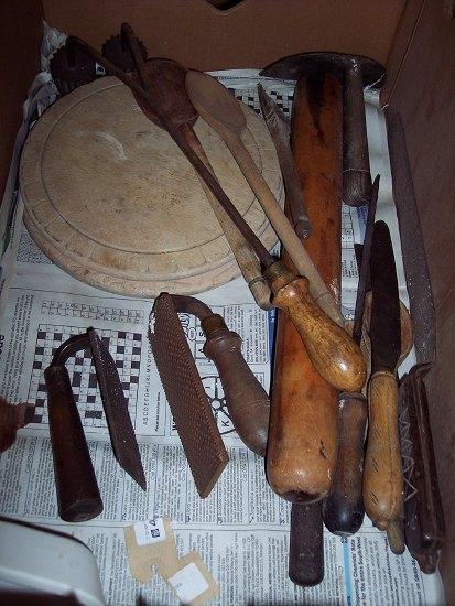 Appraisal: Two bread rasps with turned wooden handles and sundry utensils