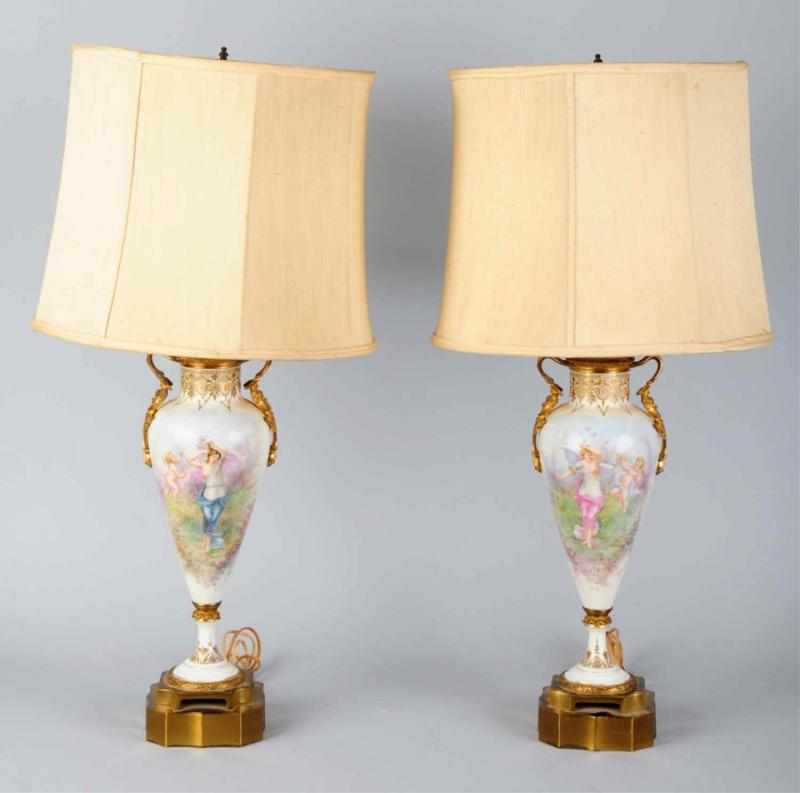 Appraisal: Pair of Porcelain Lamps Circa Both signed and depicting women