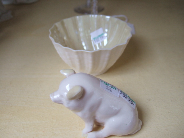 Appraisal: A Belleek porcelain figure of a pig and a shell