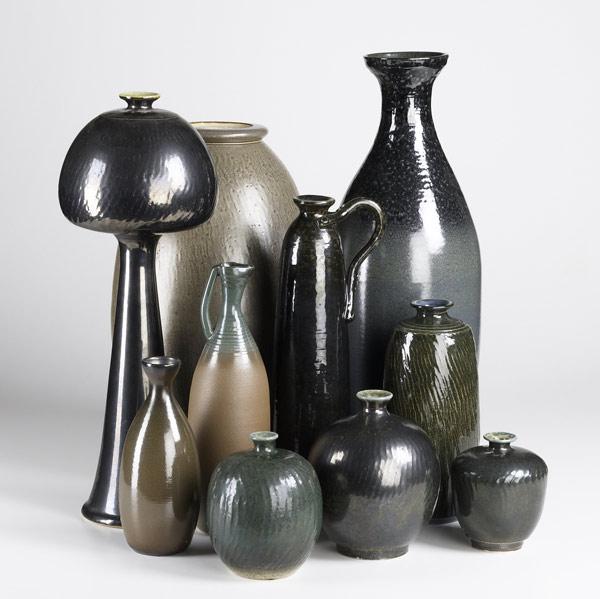 Appraisal: JIM SPIRES Ten pieces include nine vases and an ewer