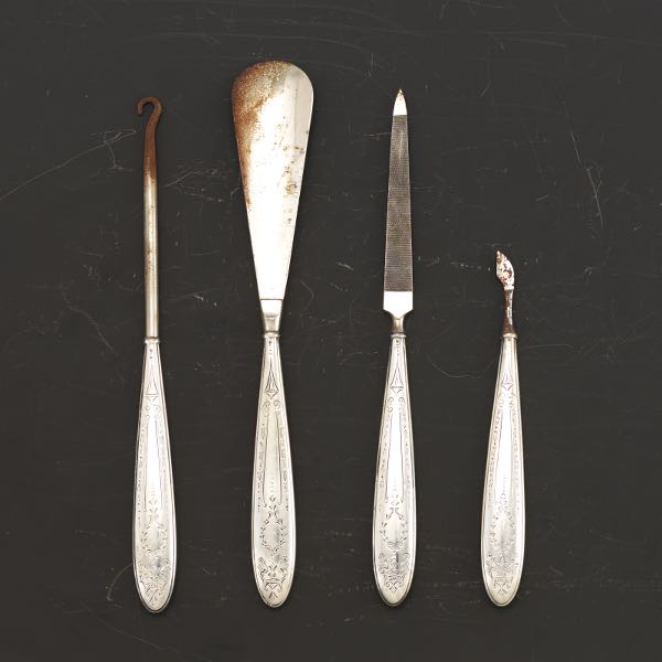 Appraisal: SET OF FOUR GENTLEMAN'S VANITY TOOLS WITH STERLING HANDLES Including