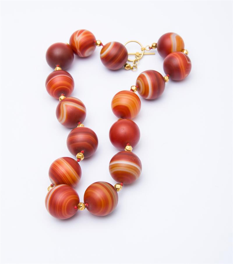 Appraisal: K YELLOW GOLD AND RED AGATE BEADED NECKLACE Designed with