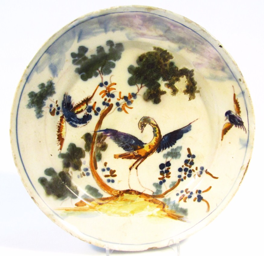 Appraisal: A tin glazed pottery dish of circular outline polychrome decorated