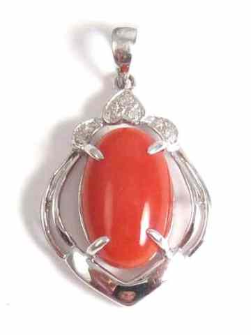 Appraisal: CORAL AND DIAMOND PENDANT k white gold set with round-cut