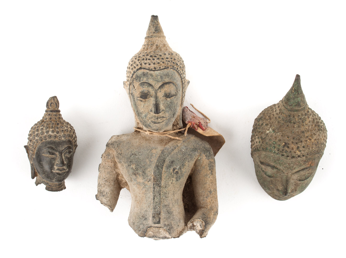 Appraisal: Three Thai bronze fragments comprising head and torso of the