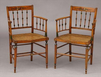 Appraisal: PAIR OF ENGLISH POLYCHROME-PAINTED AND STAINED BEECHWOOD ARMCHAIRS Each curved