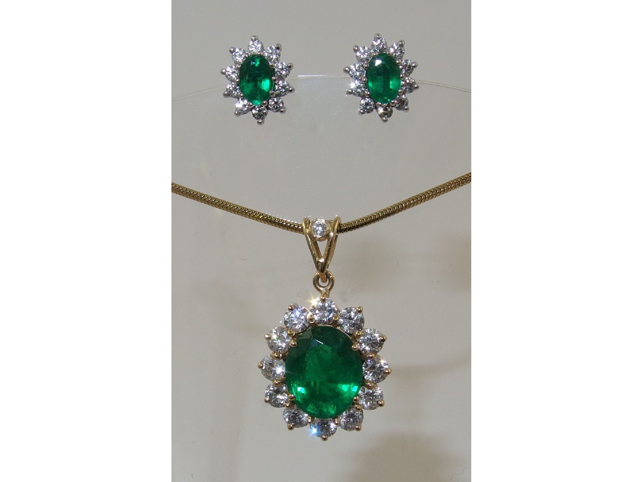 Appraisal: An emerald and diamond suitecomprising of an ct yellow gold