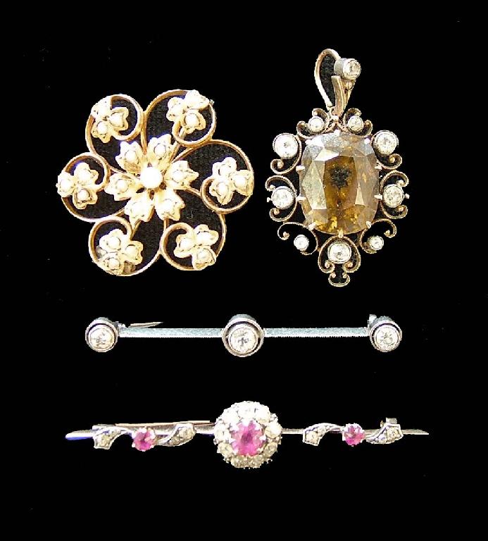 Appraisal: Oval Zircon gold brooch within a scroll setting set with