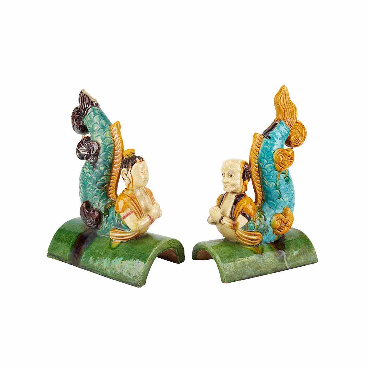 Appraisal: Pair of Sancai Glazed Roof Tiles Each rendered as a