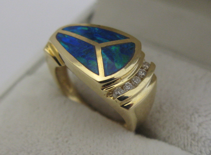 Appraisal: OPAL DIAMOND AND K GOLD RING set with three tablets