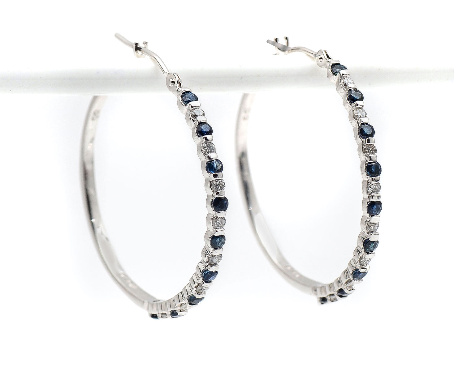 Appraisal: K DIAMOND SAPPHIRE EARRINGS K white gold hoop earrings contain