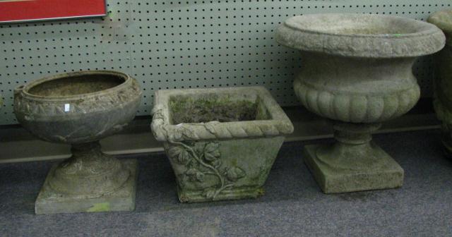 Appraisal: Group of three ornamental concrete planters various styles