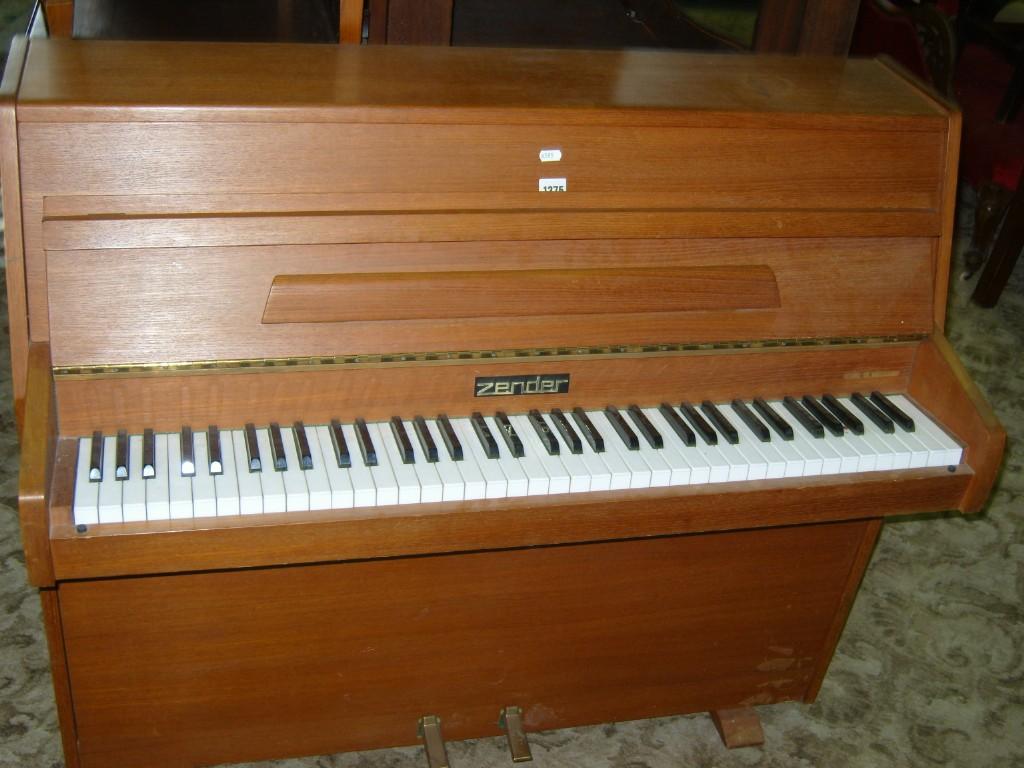 Appraisal: A small modern iron framed over strung piano in teak