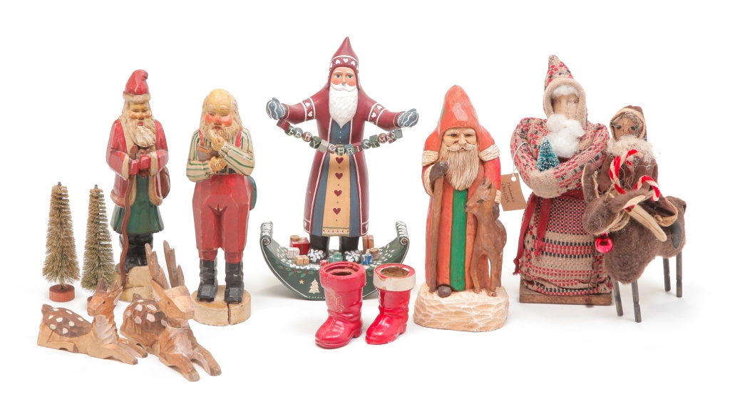 Appraisal: Including carved wood Santa's a plush Santa wearing coverlet coat