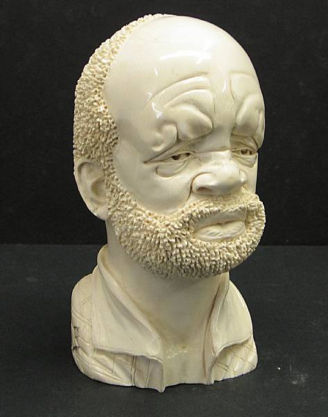 Appraisal: An African carved ivory portrait bust of a bearded man