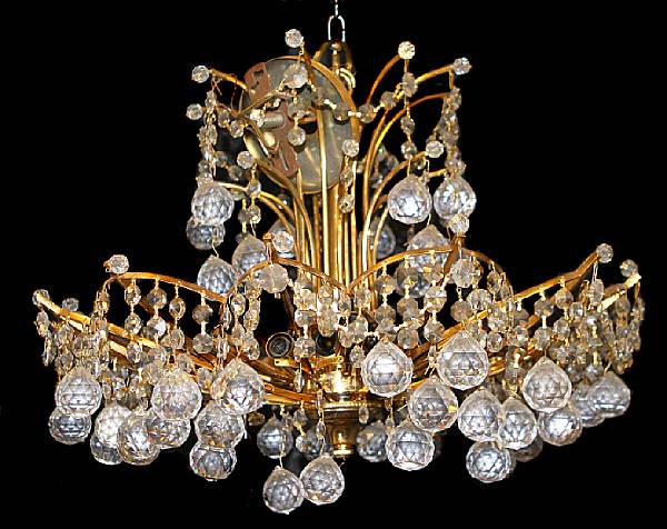 Appraisal: A crystal and brass twelve light chandelier height in diameter