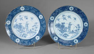 Appraisal: Pair Delft chargers both with figures in garden setting powder