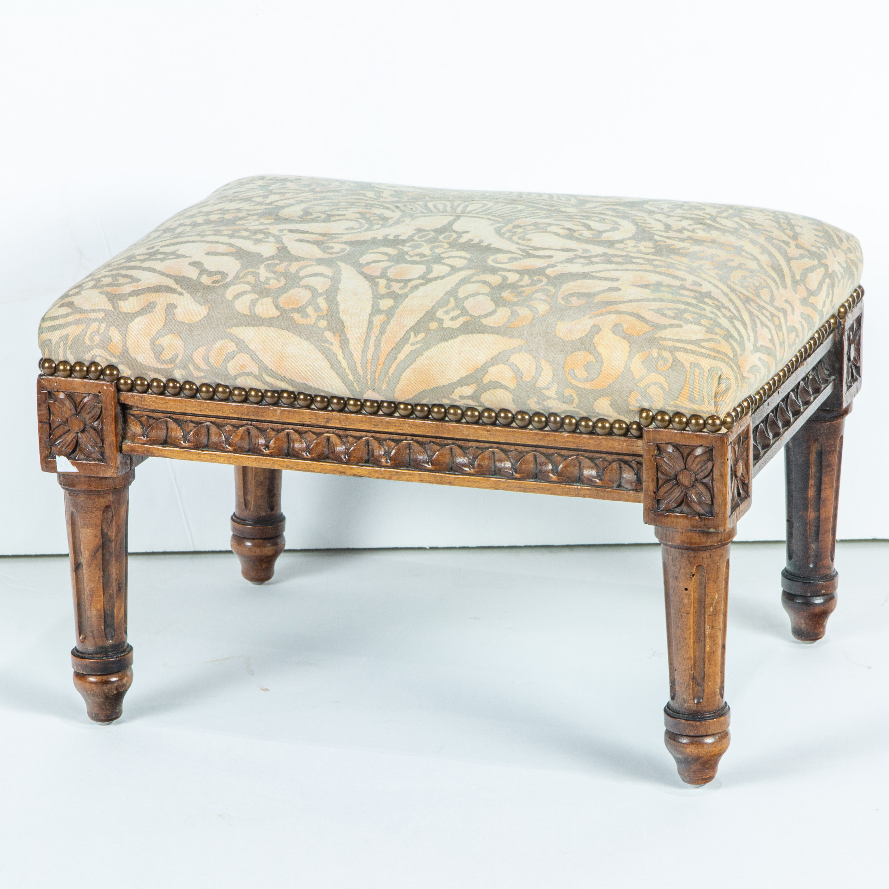 Appraisal: NEOCLASSICAL STYLE CARVED AND UPHOLSTERED FOOTSTOOL Neoclassical style carved and