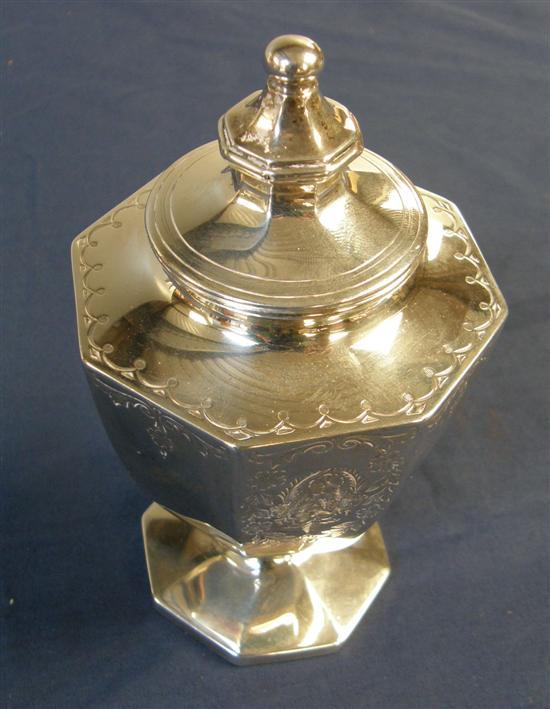 Appraisal: American silver urn shaped tea caddy with engraved floral decoration