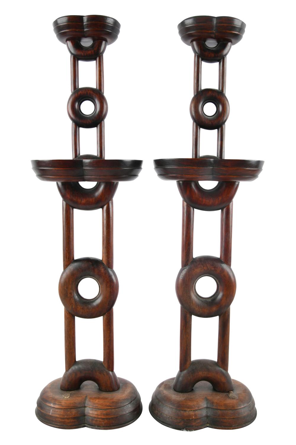 Appraisal: PAIR OF CHINESE CARVED HARDWOOD CANDLESTICKSwith removable brass cups inches