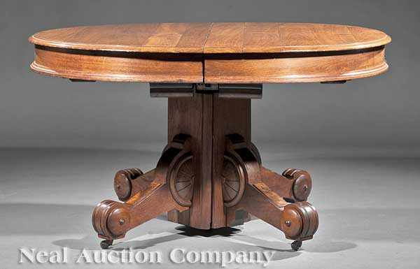 Appraisal: An American Renaissance Carved and Burled Walnut Extension Dining Table