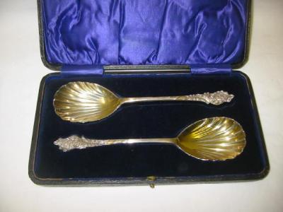 Appraisal: A PAIR OF VICTORIAN SERVING SPOONS with fluted bowls the