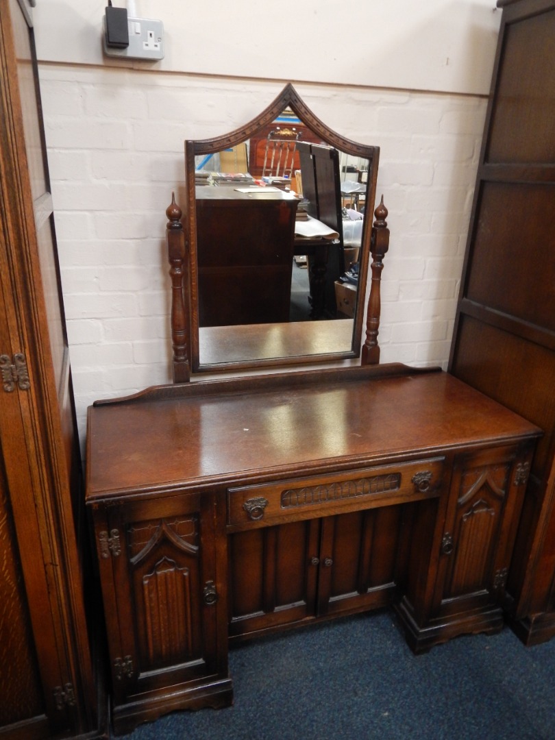 Appraisal: An Old Charm dressing table with a single frieze drawer