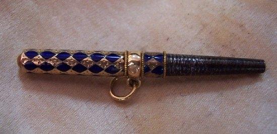 Appraisal: A gilded and blue enamel ratchet watch key