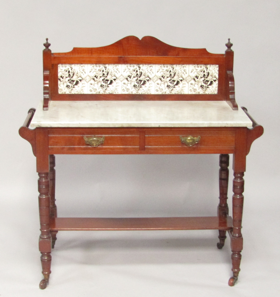 Appraisal: A Victorian mahogany washstand with a tiled splash back and