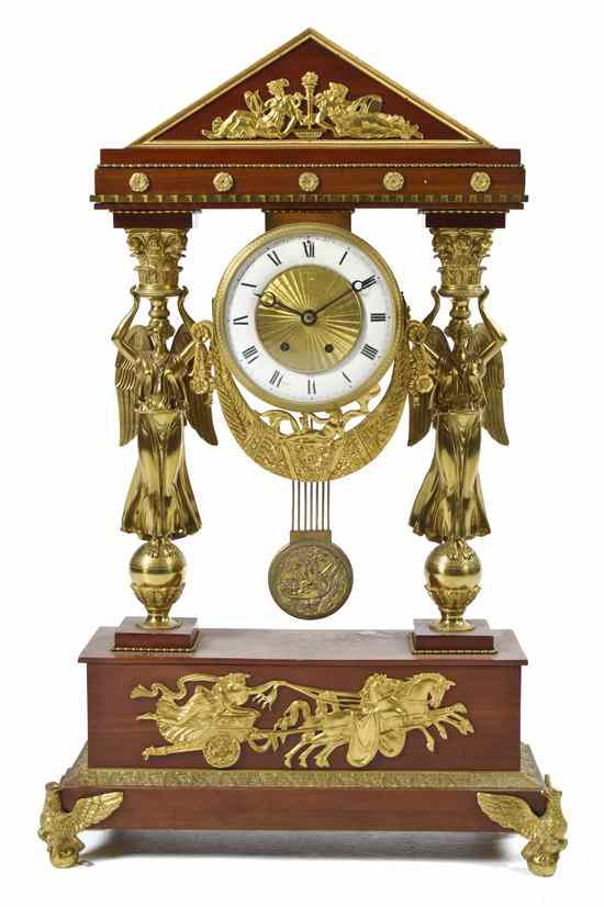 Appraisal: An Empire Gilt Bronze Mounted Mahogany Portico Form Mantel Clock