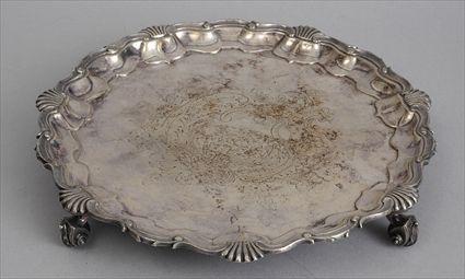 Appraisal: ENGLISH SILVER-PLATED TRIPOD SALVER The piecrust rim cast with shells