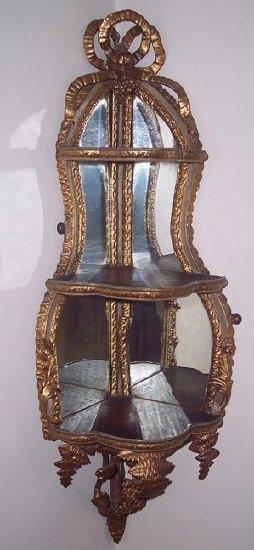 Appraisal: A pair of plaster gilt mirror back corner displays moulded