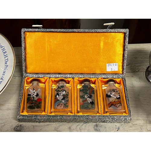 Appraisal: Cased set of four Chinese reverse painted glass snuff bottles