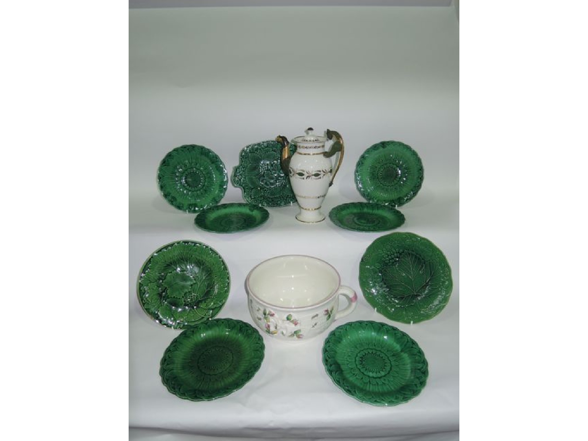 Appraisal: A collection of th century green glazed majolica leaf moulded