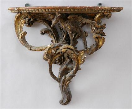 Appraisal: GEORGE III-STYLE CARVED GILTWOOD WALL BRACKET The shaped top with