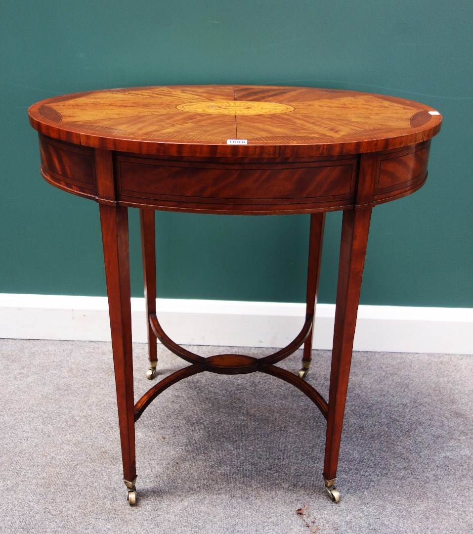 Appraisal: An Edwardian tulipwood banded mahogany inlaid occasional table the oval