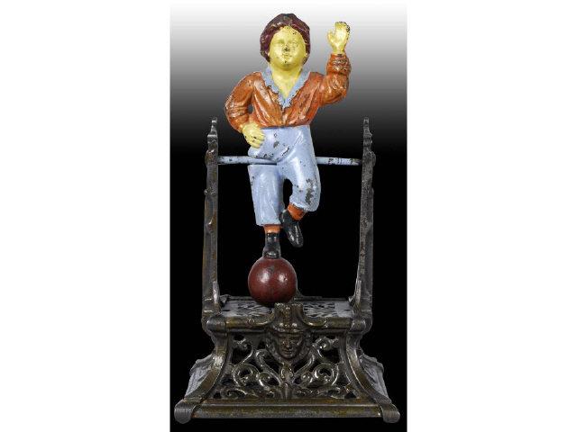 Appraisal: Cast Iron Boy on Trapeze Mechanical Bank Description Manufactured by