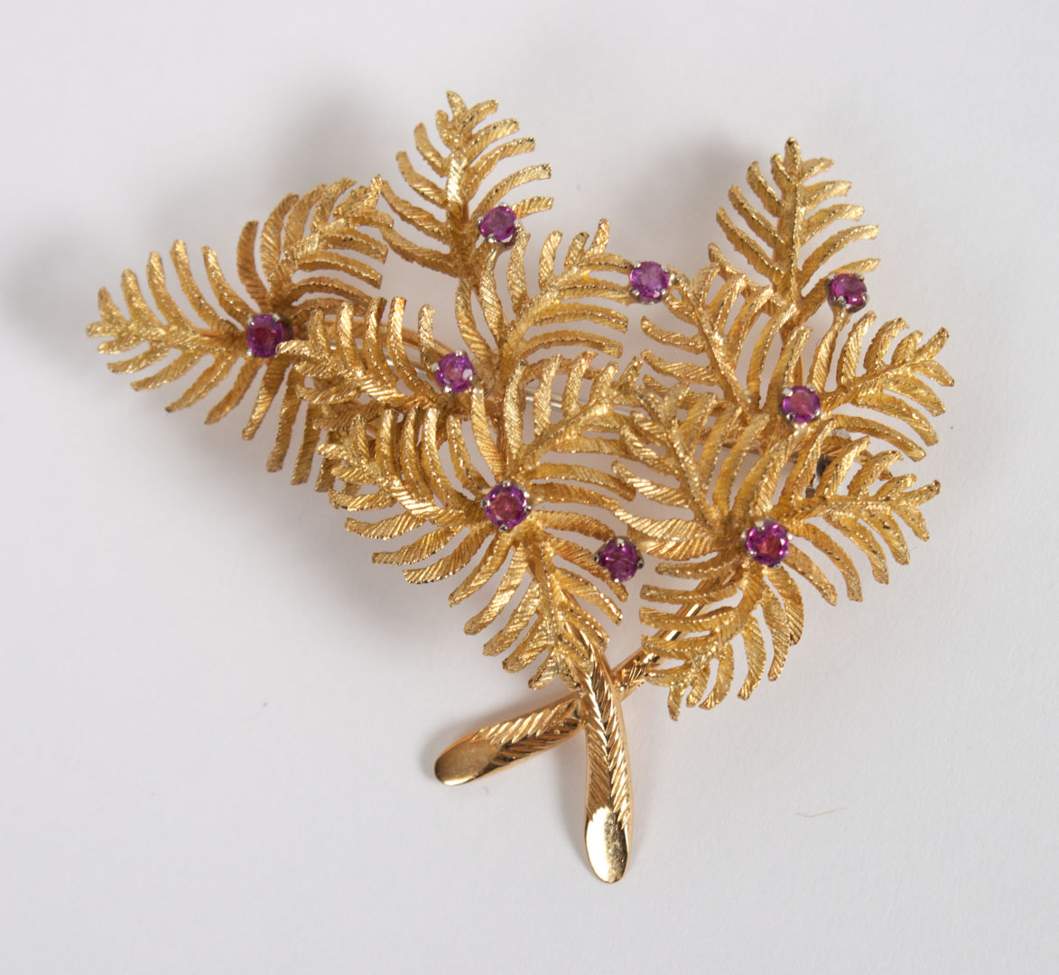 Appraisal: Lady's K gold and ruby Toliro brooch Italian leaf-form brooch