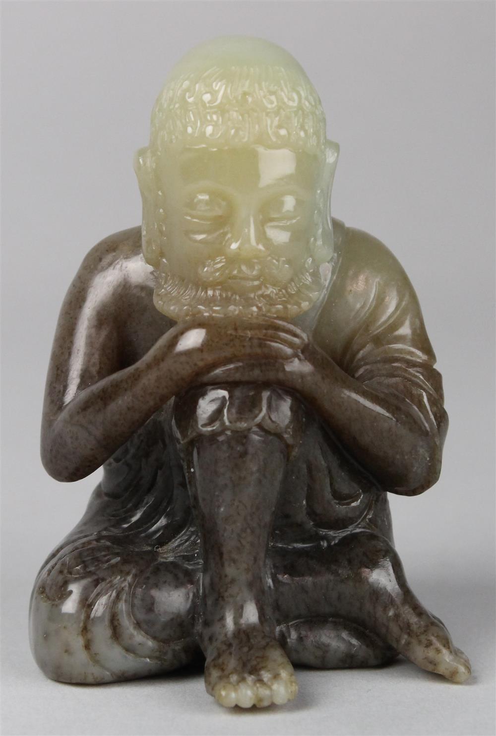 Appraisal: PALE GREEN AND BROWN JADE FIGURE OF A SEATED LUOHAN