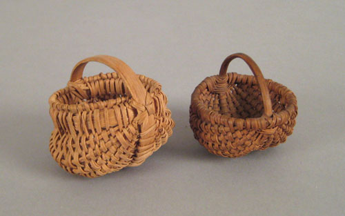 Appraisal: Two miniature splint oak buttocks baskets th c h w