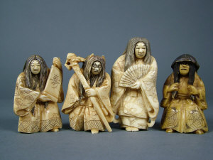 Appraisal: Three Japanese ivory netsukes with revolving faces carved as entertainers