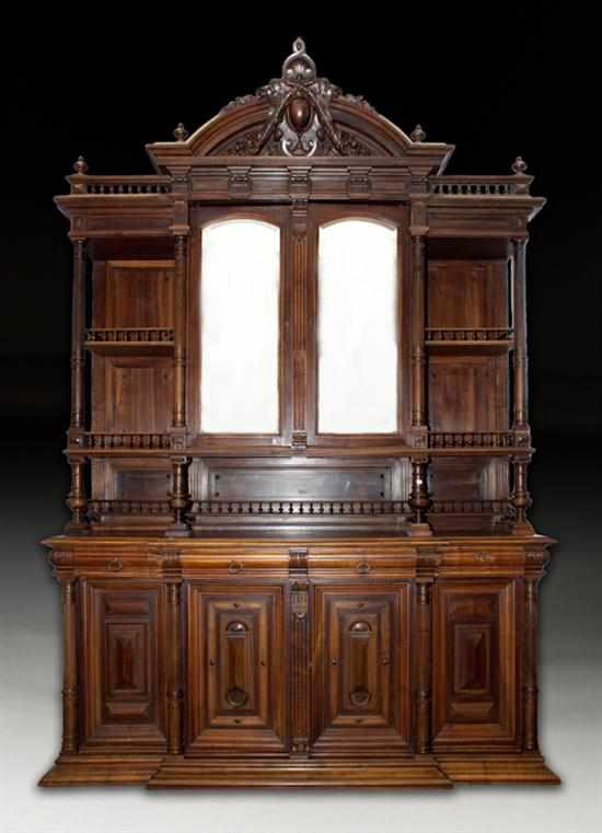 Appraisal: Monumental Louis XVIII style carved walnut mirrored door buffet haut