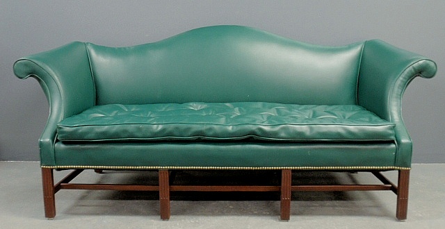 Appraisal: - Kittinger Chippendale style faux green leather camelback sofa with