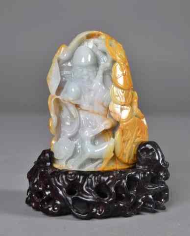 Appraisal: Chinese Carved Jadeite MountainFinely carved to depict a standing figure