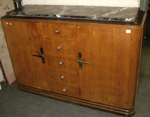 Appraisal: An Art Deco mahogany side cabinet with variegated marble top