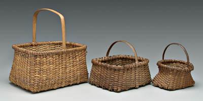 Appraisal: Three cane oak split baskets one rectangular gathering basket -