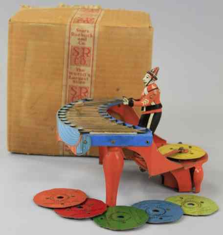 Appraisal: ZILOTONE Wolverine Mfg tin musical toy depicts figure at play