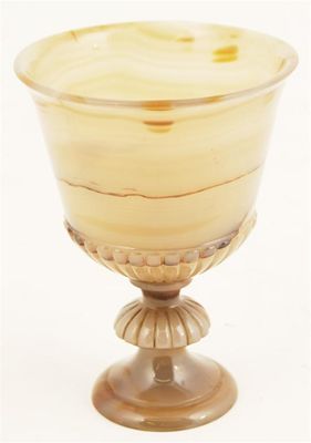 Appraisal: A turned agate stem cup of campana form th century