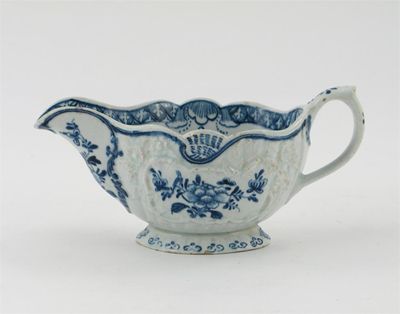 Appraisal: An English porcelain blue and white large sauceboat moulded with